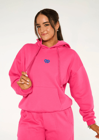 Dance model wearing CD Hoodie by Claudia Dean Hot Pink front view