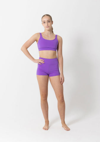 Dance model wearing Studio 7 Performance Crop Top in Amethyst front view.