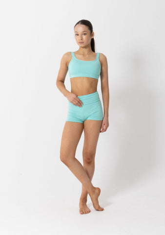 Dance model wearing Studio 7 Performance Crop Top in Mint front view.