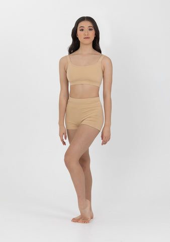 Dance model wearing Studio 7 Performance Crop Top in Cashew front view.
